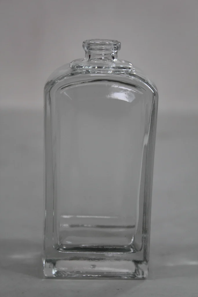 Clear glass bottle shown as a visual reference for a packaging design brief