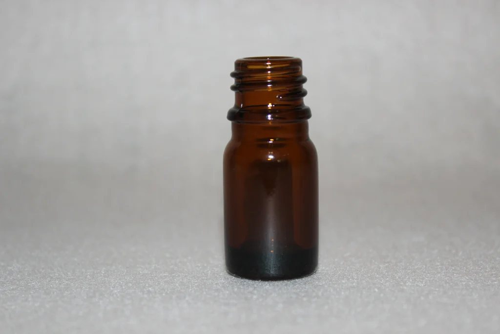 Amber glass bottle shown as a visual reference for a dropper bottle packaging brief
