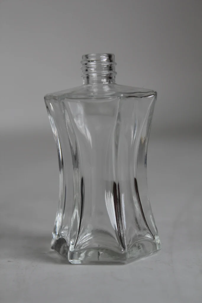 Clear glass perfume bottle shown as a visual reference for a design brief